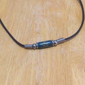 Teal bead on leather necklace